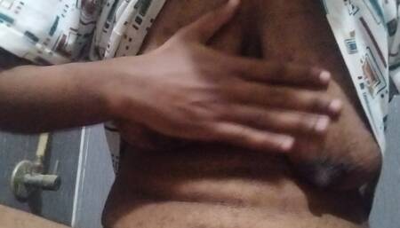 Busty Indian babe playing with her boobs and pussy while peeing