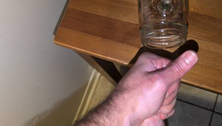 Fat man jerking his hard cock and cumming in a glass