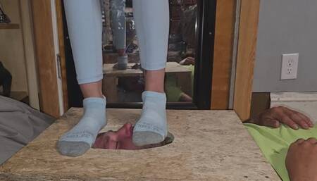 Chrissy stomping on Dans face in a facebox