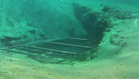 Breathholding, Diving Posing and swimming over a Spring Cave in Snorkeling Mask with fish everywhere