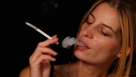 Sexy blonde Eve smokes long cigarette with huge ash and pleasure