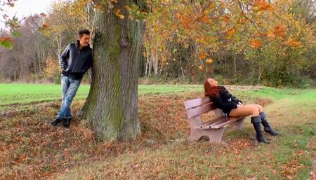 Hot red colored girl stays and enjoys outdoor masturbation