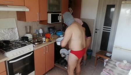 Couple Having Fun in the Kitchen. Sexy Wife Doing Chores in the House Naked