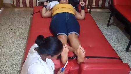 Eli provokes laughter by tickling Anyeli's feet!