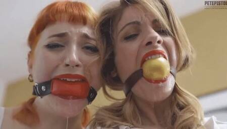 Secretaries Alba and Royal tightly ballgagged and bound, trying to escape