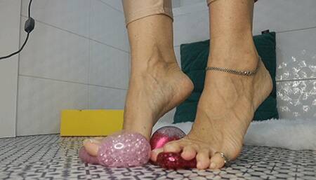 Foot stomping on two rubber antistress balls WMV