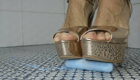 Gold high heels crush chalk tubes