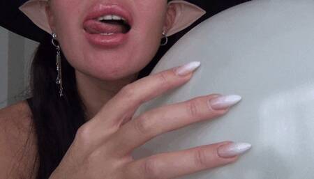 The shrill sound of a witch scratching a balloon a