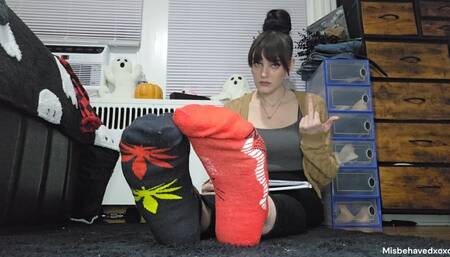 Ignoring you, flipping you off and telling you how pathetic you are while you stare at my socked feet.