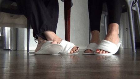 Wiggling our toes under the dining table in slippers b