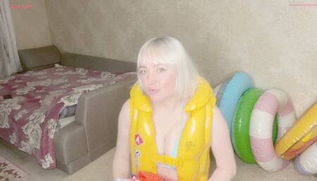 Alla inflates six inflatable armbands with her mouth