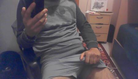 The man left alone at home watches porn on his phone and cums