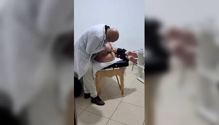 A MILF Gets Fingered by the Proctologist During an Anal Exam.