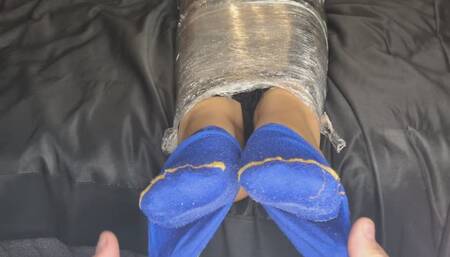 Part 1: Completely wrapped in cling film, unable to move.