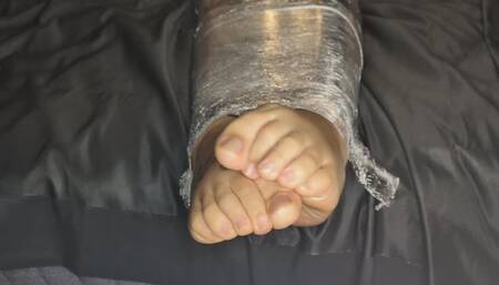 Part 2: Completely wrapped in cling film, unable to move.