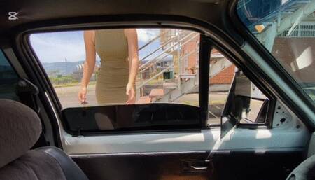 Anie, wearing a short dress, drives an old Chevette that breaks down a lot.