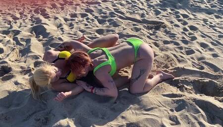 Two Lesbian Hotties Wrestling on the Beach and After That Start Kissing