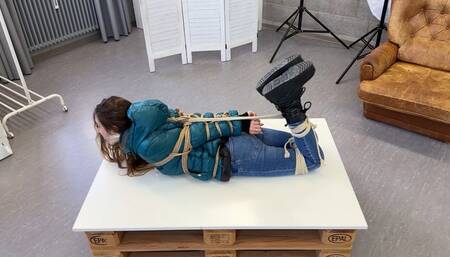 Rey Sanson bound and gagged in shiny nylon Down