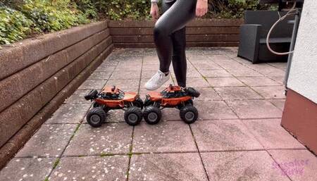Sneaker-Girl Akira - Two Big Monster Truck Cars