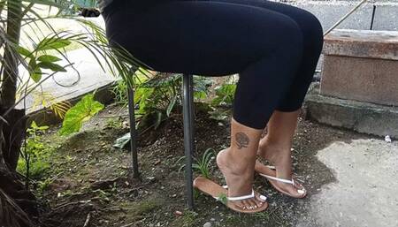 Woman uses fingernails to scratch her feet (3)