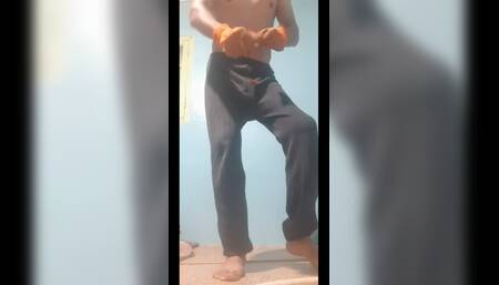 A sexy athletic man takes off his clothes and dances