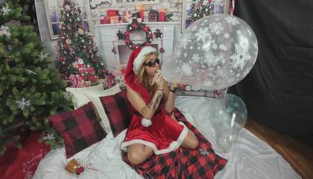Evil-Lyn2912 as Mrs Santa blow 2 pop a 18inch stuffer balloon
