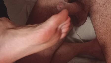 Feet teasing cock after chastity