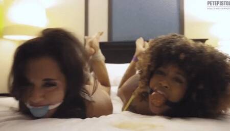 Female wrestlers Tomiko and Reagan Kennedy are hog tied and ball gagged trying to free themselves Slow Motion