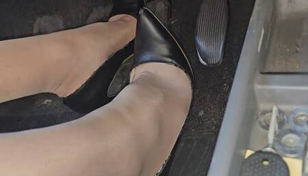 Driving Fiat Panda in black high heels