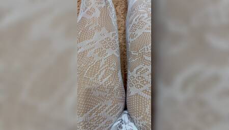 Rubbing my slim legs in hot stocking and heels