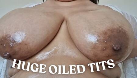 Huge oiled tits
