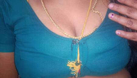 Tamil aunty squeezing her breasts when she is alone and unable to control her emotions.