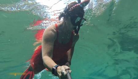 Carissa snorkeling in her Christmas outfit with exposure part two