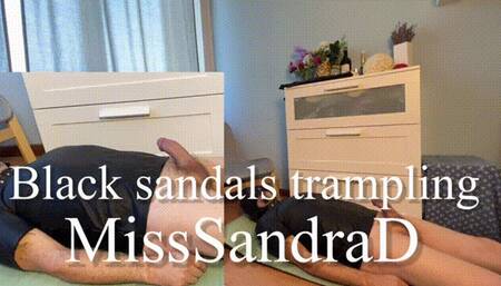Black sandals trampling