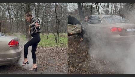 The Volkswagen makes a lot of smoke. Nastya warms her feet near the exhaust pipe.