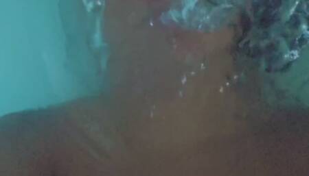 Holding my breath in the bathtub and blowing bubbles