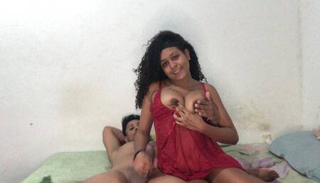 Beautiful brunette cowgirl sits and gets milk
