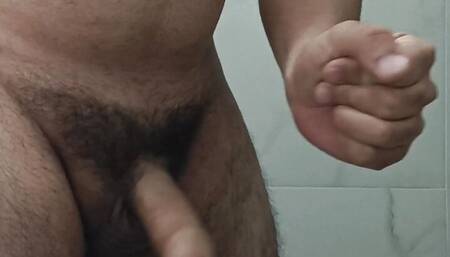 Pedro Pimentel jerking off in the toilet.  Horny, his big thick cock spurts hot cum.